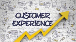 wall with grffity 'customer experience'