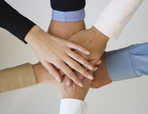 Group of hands together on top of each other