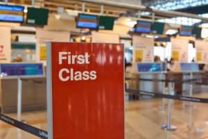 sign showing first class on an airport