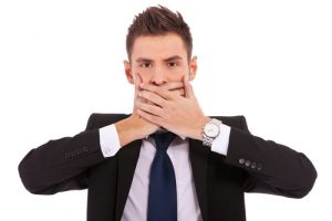 businessman holding his mouth with his hands