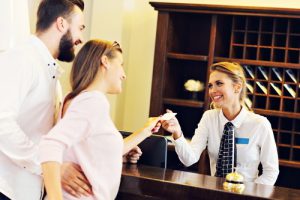 Couple receives an electronic key from receptionist