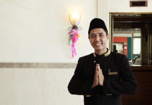Welcome greeting gesture from south east asia man at hotel