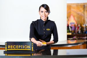 Receptionist hands over an electronic key