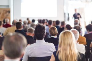 audience looking at a speaker